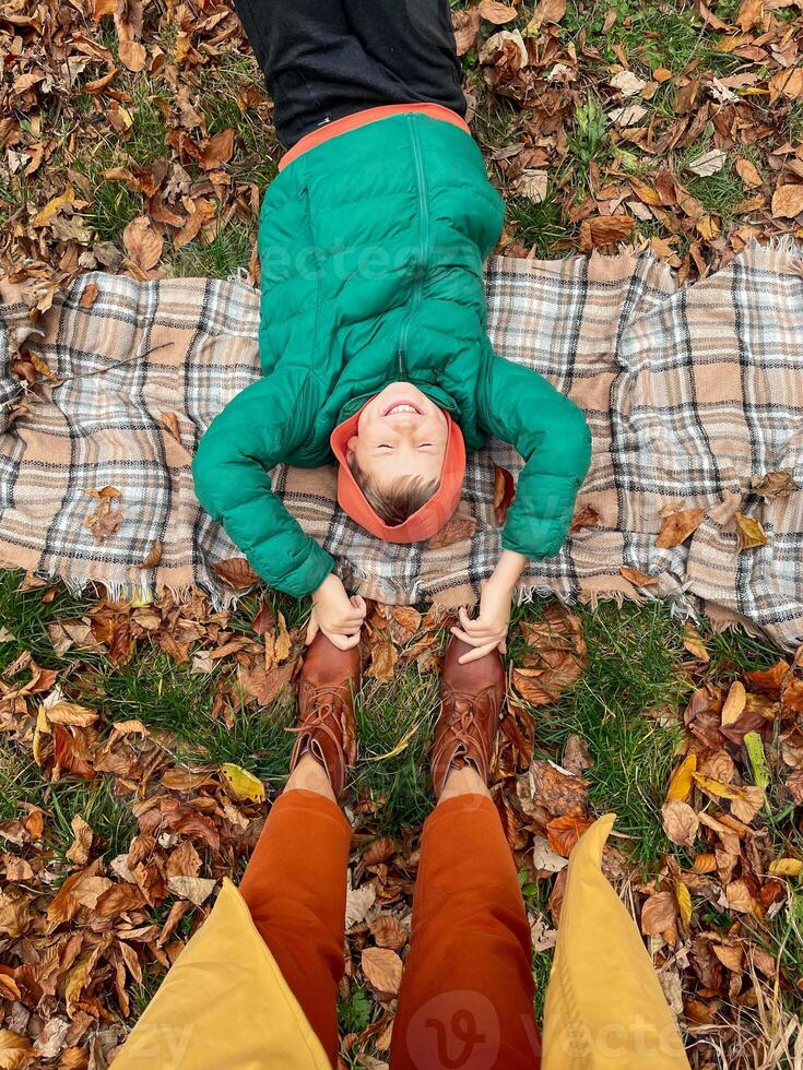Happy Child Having Fun in Autumn Park photo