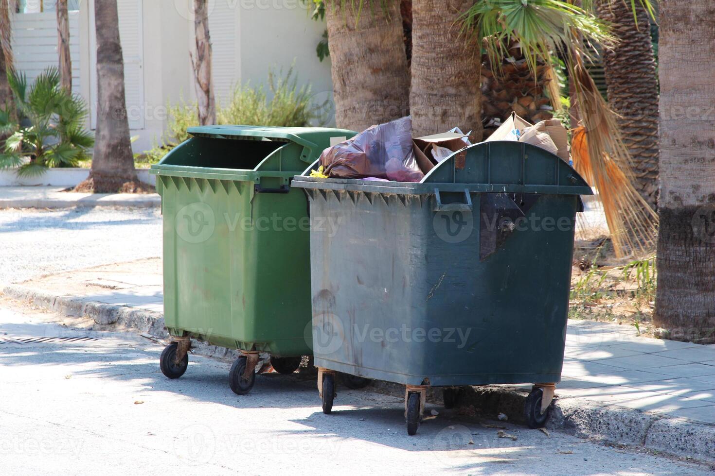 Green and blue recycling Plastic bin container or garbage Trash Can on the street Cyprus photo