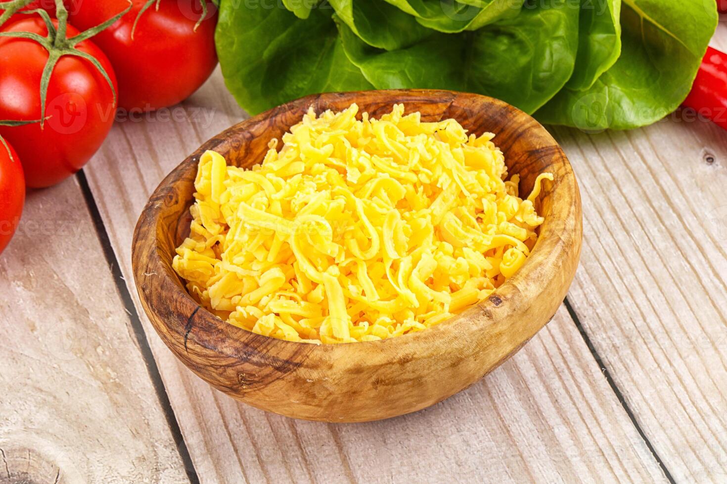 Shredded cheese in the bowl photo