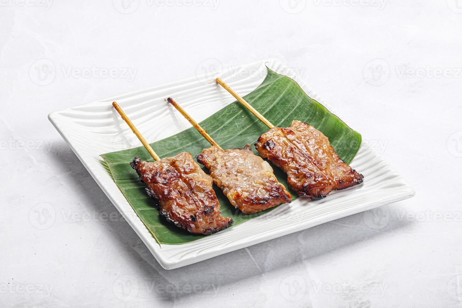 Thai cuisine - grilled pork skewer photo