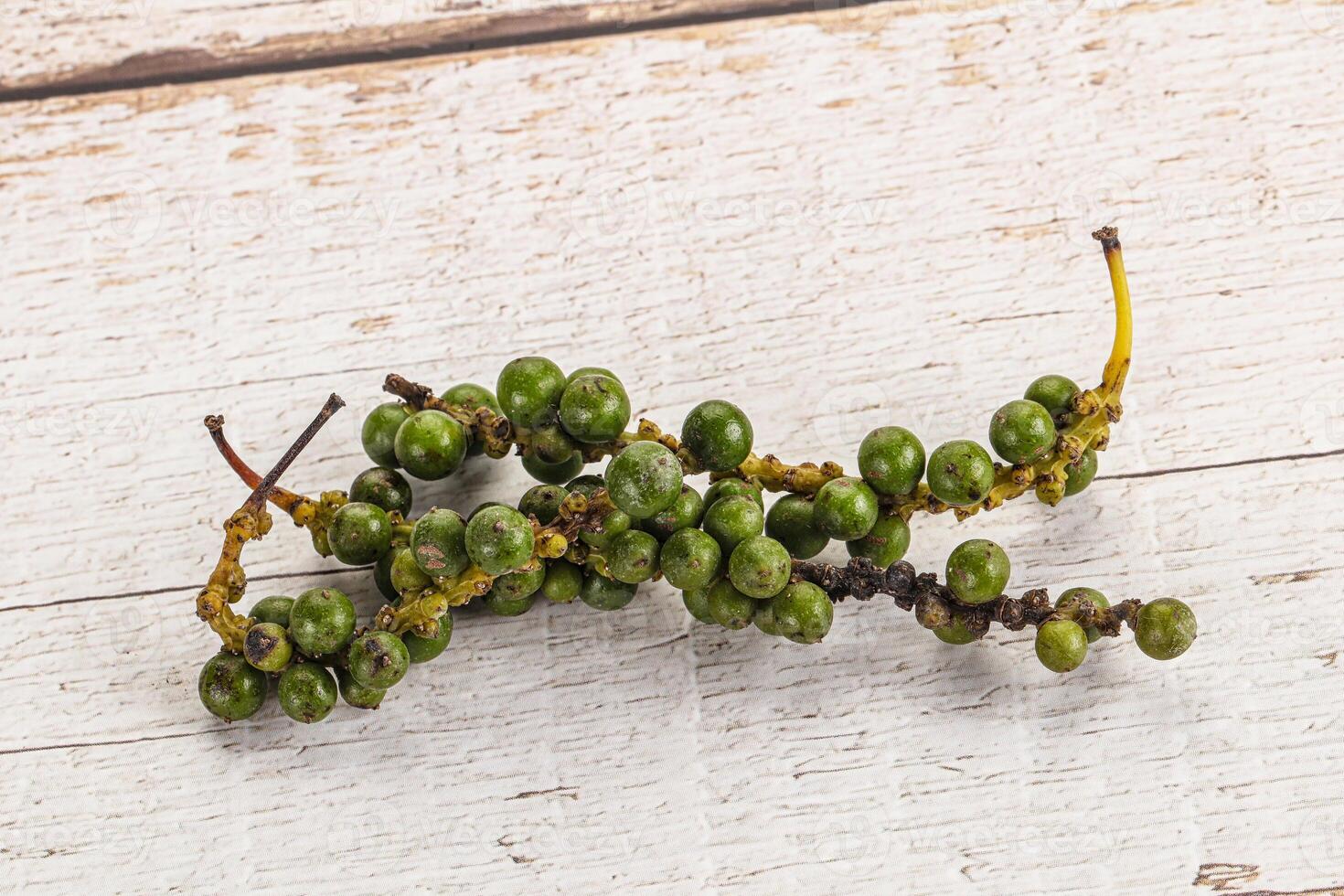 Green pepper corn heap isolated photo