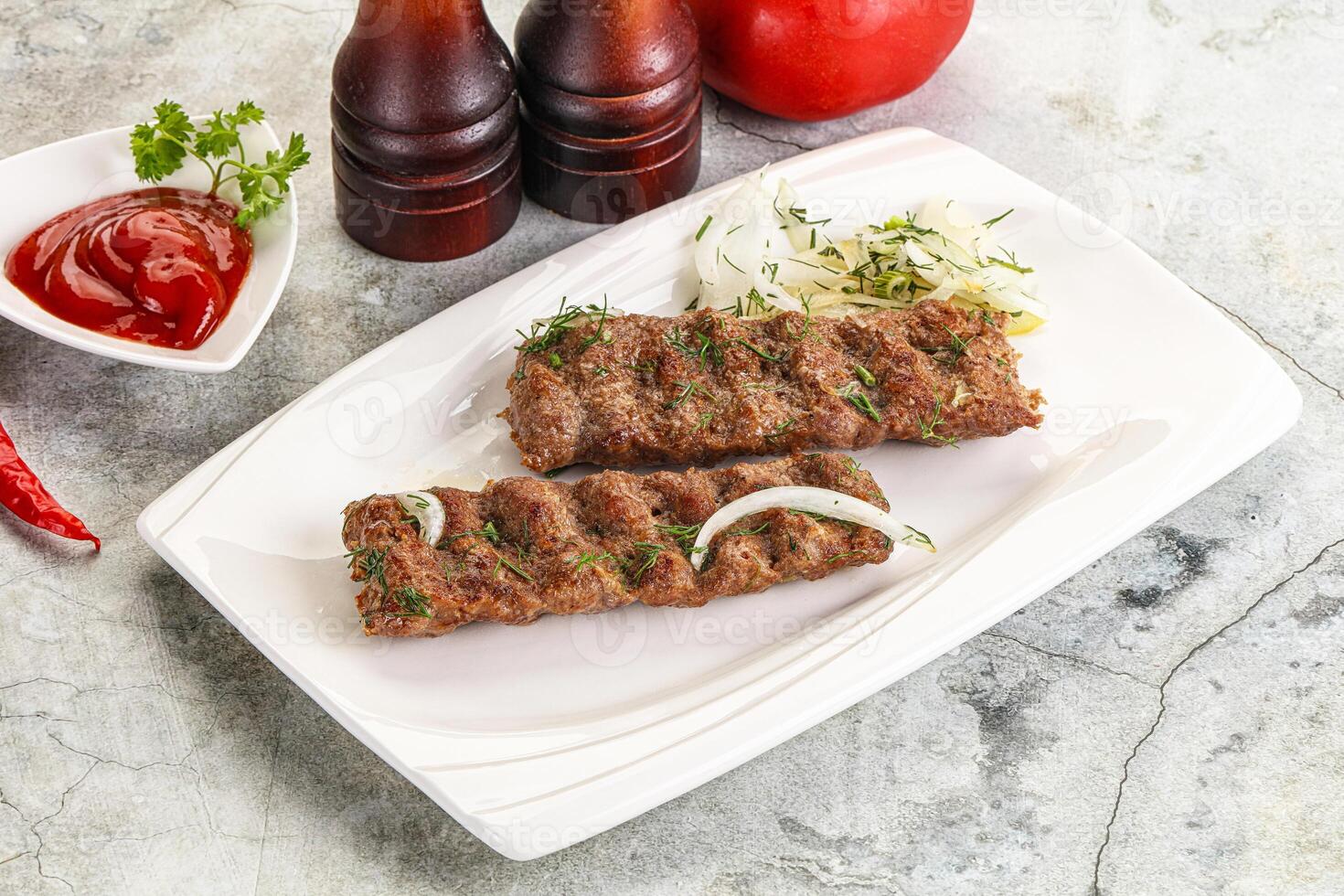 Kebab with beef served onion photo
