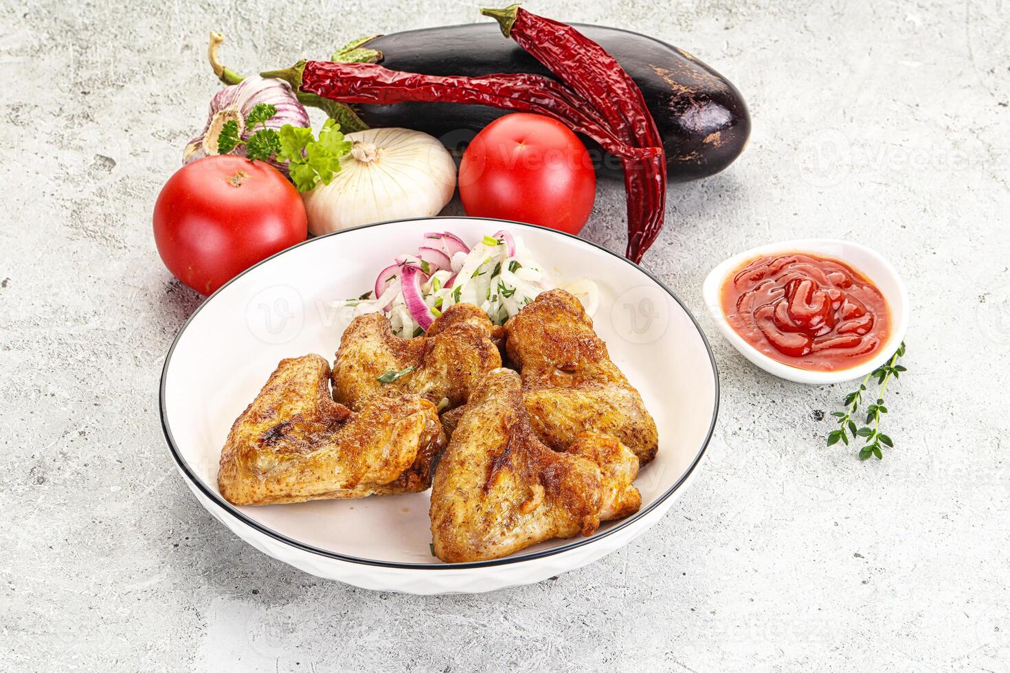 Grilled chicken wings with sauce photo