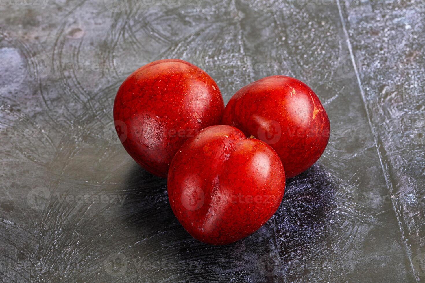 Ripe sweet juicy red plum photo