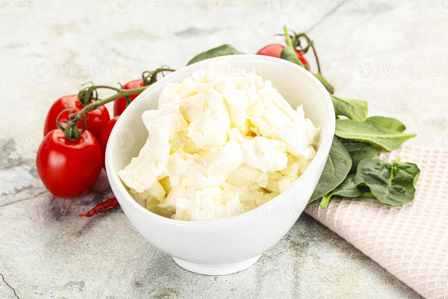 Soft cream cheese in the bowl photo