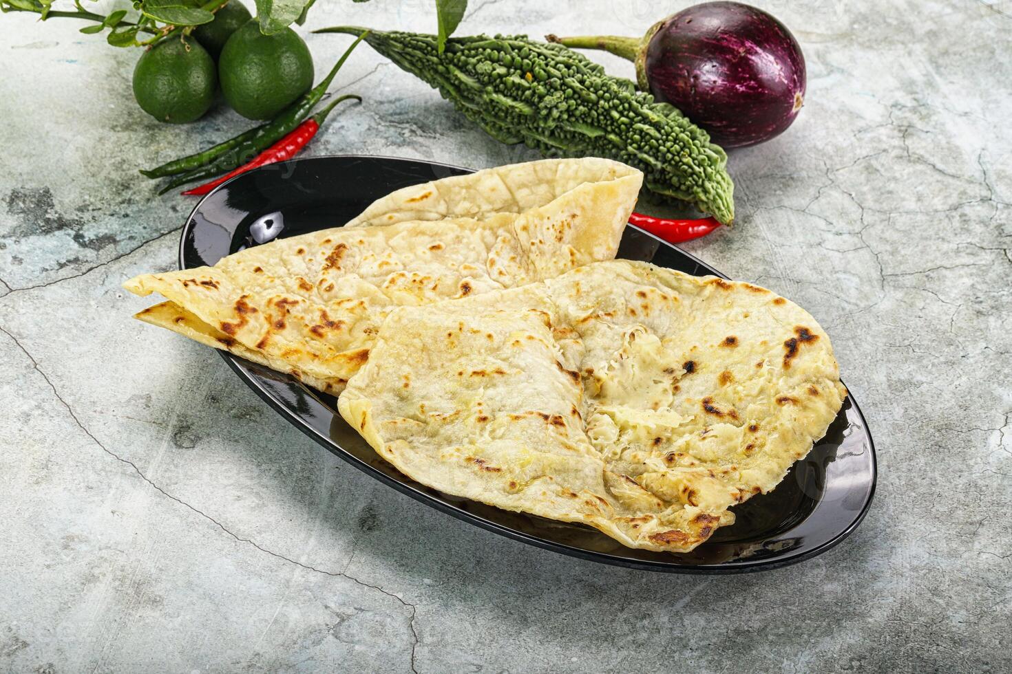 Indian tandori bread - naan with cheese photo