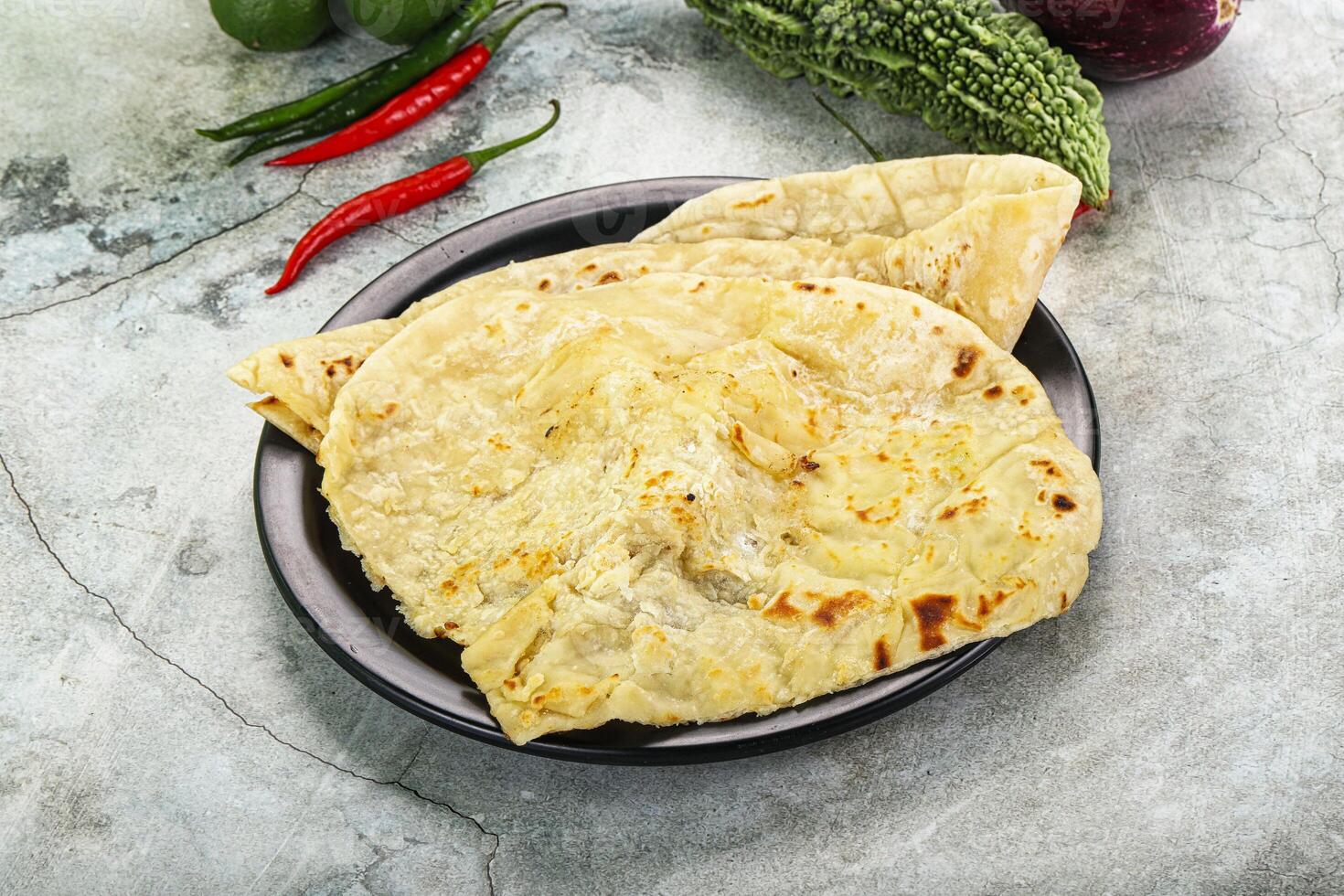 Indian tandori bread - naan with cheese photo