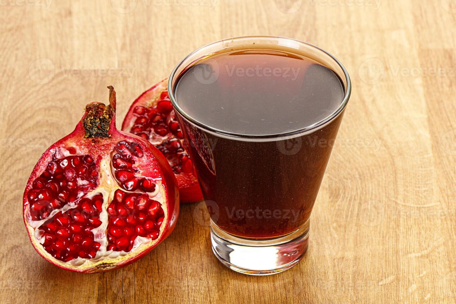 Sweet pomegranate juice in glass photo