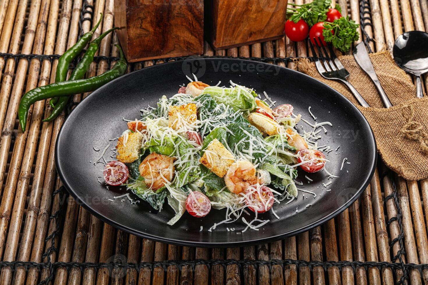 Tasty Caesar salad with prawn photo