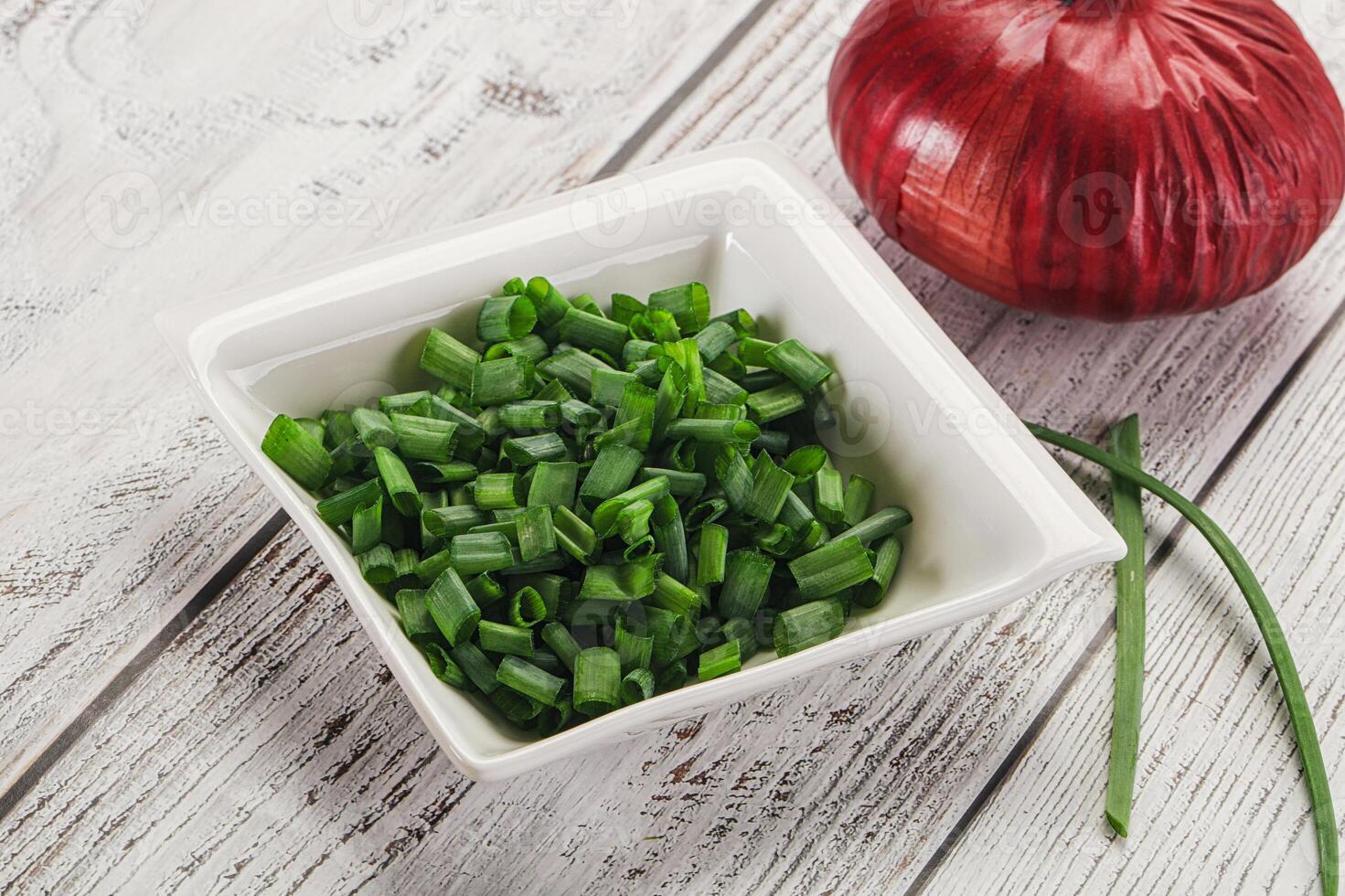 Diced green onion in the bowl photo