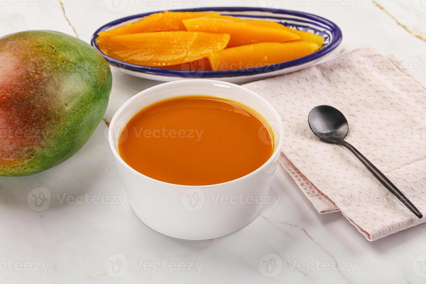 Sweet mango puree in the bowl photo