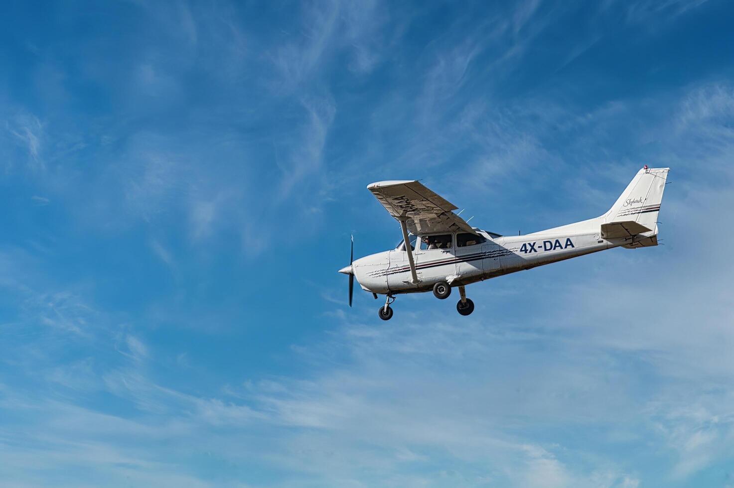 Herzliya, Israel. May 1, 2023. CESSNA 172M SKYHAWK with cloud sky landing configuration, copy space. photo