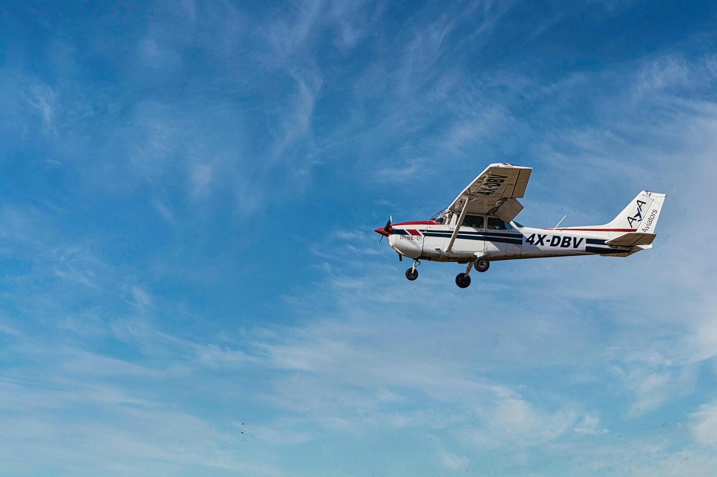 Herzliya, Israel. May 1, 2023. CESSNA 172M SKYHAWK with cloud sky landing configuration, copy space. photo