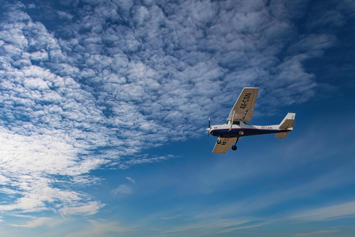 Herzliya, Israel. May 1, 2023. CESSNA 172M SKYHAWK with cloud sky landing configuration, copy space. photo