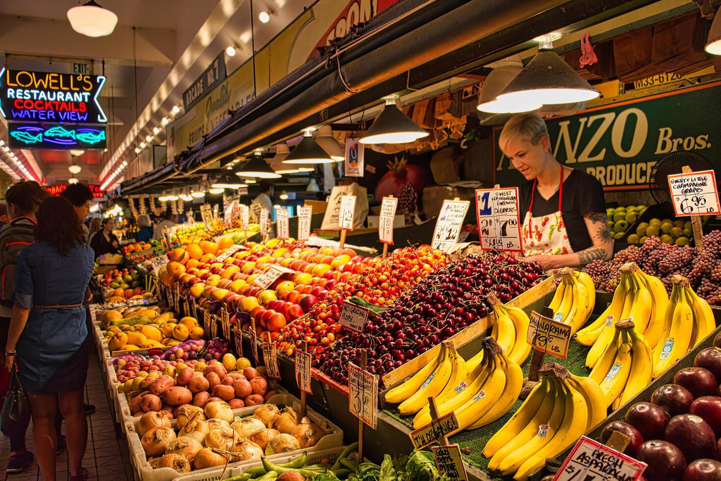 SEATTLE, WASHINGTON, USA 2017 Vegetables and fruits for sale in the high stalls at the Pike Place Market. This is a famous sight in downtown. photo