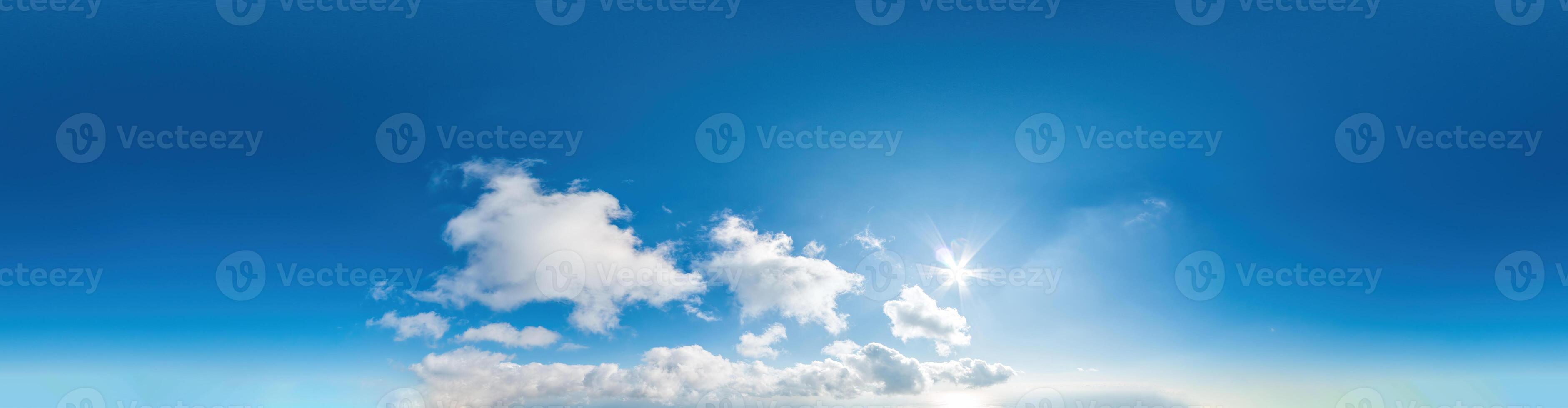 Seamless panorama of sky with light clouds in spherical equirectangular format with complete zenith for use in 3D graphics, game and for composites in aerial drone 360 degree panoramas as a sky dome. photo