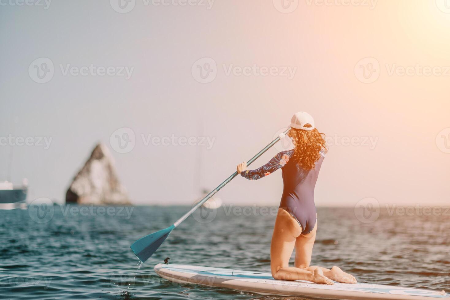 Woman sup yoga. Middle age sporty woman practising yoga pilates photo