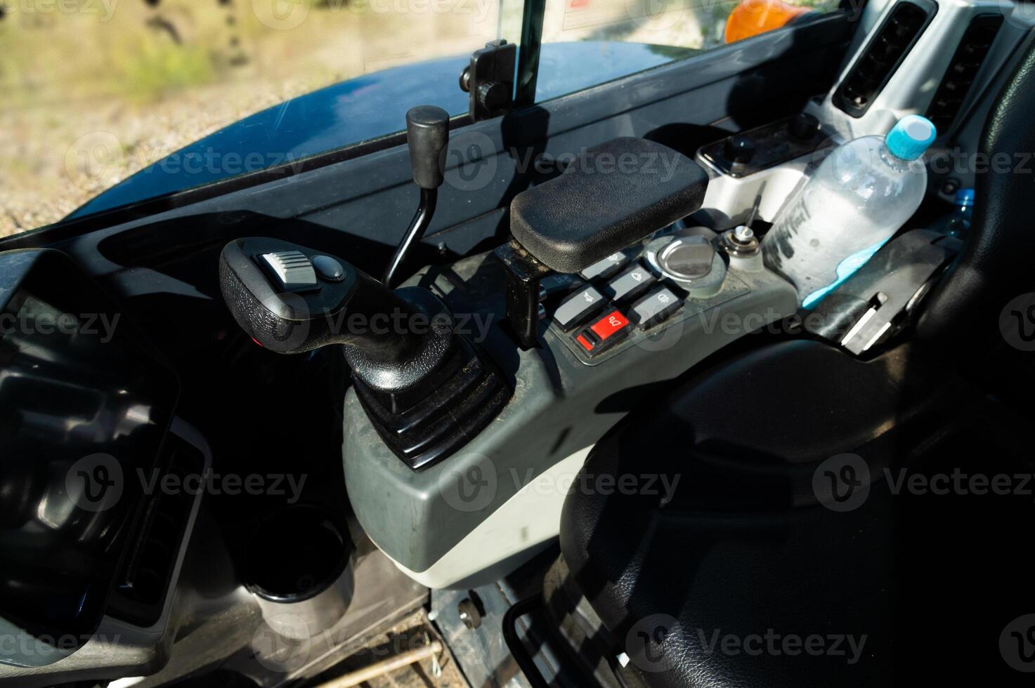 Controls of a small excavator in the cab. Background for special equipment theme concept photo