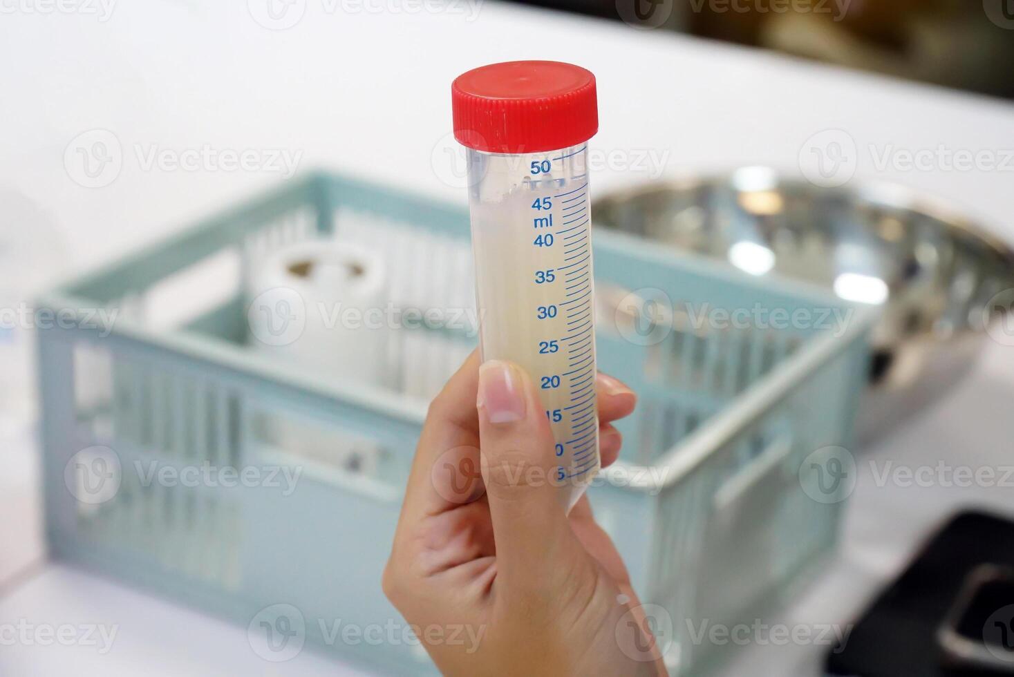 Asian students conduct a science experiment on extracting DNA from onions serves as a blueprint for everything in living cells, serving to tell the organism what it should look like and how it works. photo