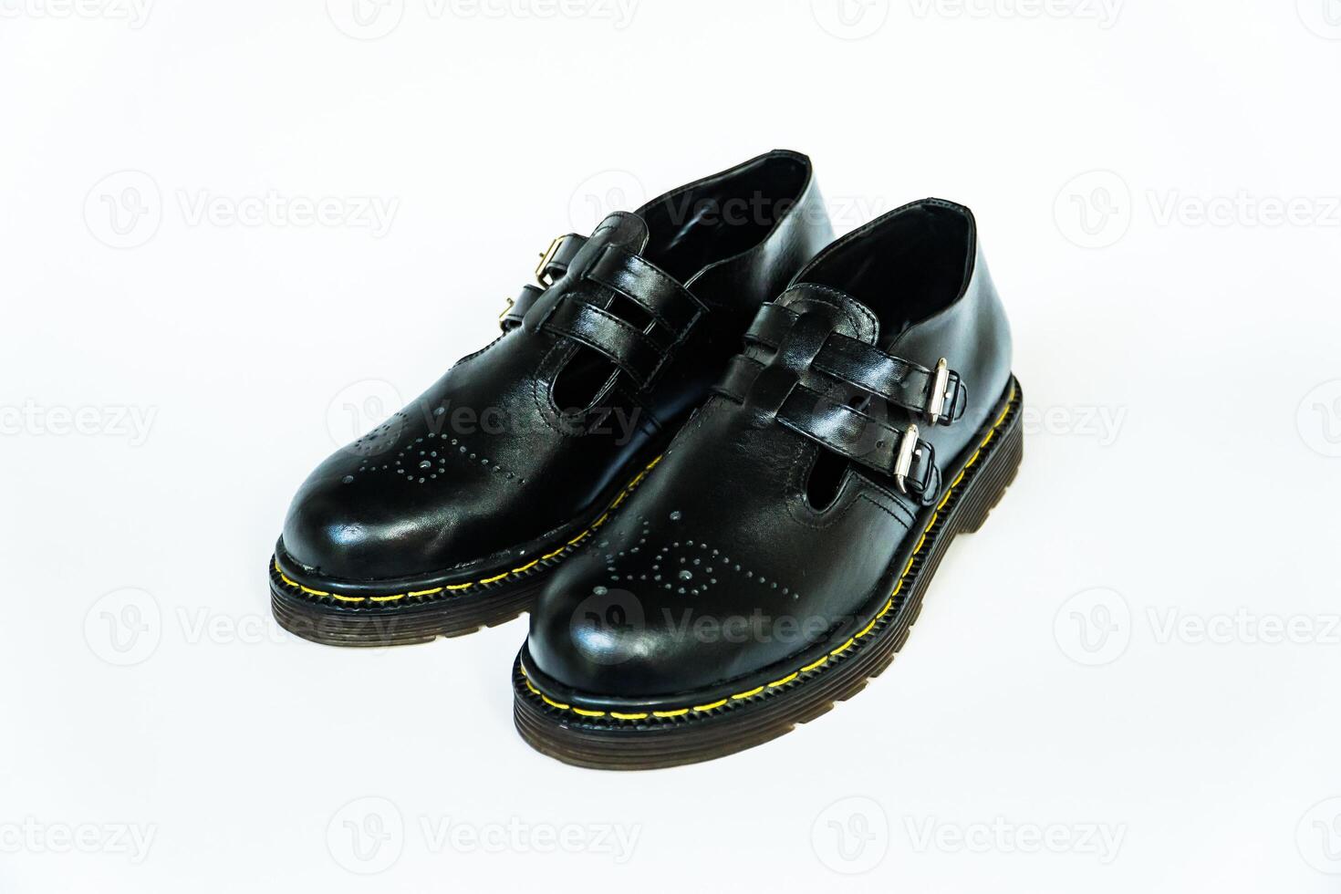 Vintage Mary Jane Rockabilly shoes in full black with rubber outsole made from genuine cowhide. Handmade shoes with neat details, very elegant and shiny on a white background photo