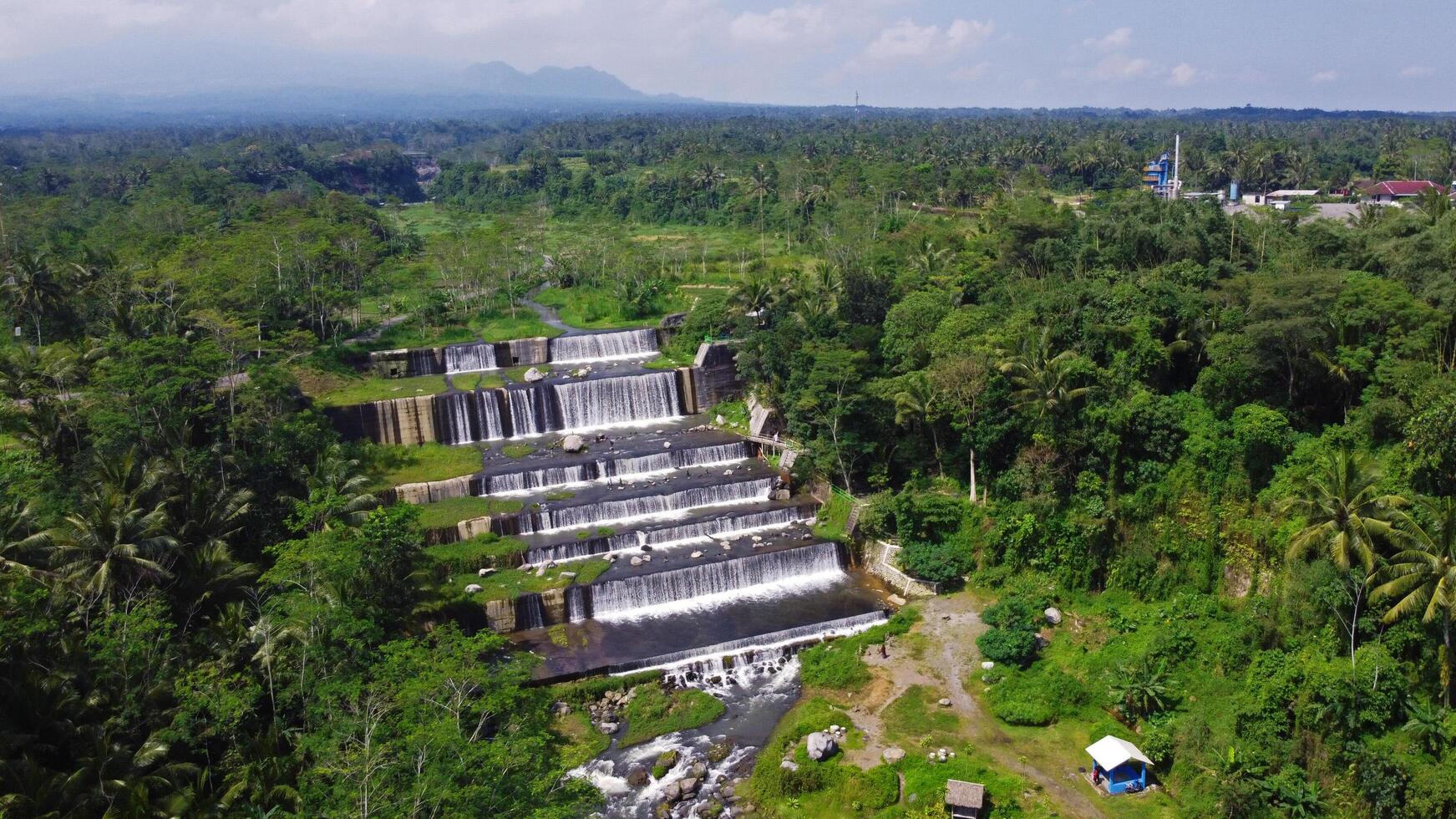 Aerial footage of the Watu Purbo Sabo Dam in Sleman, Indonesia which has a 6-level water dam. Apart from preventing the eruption of Mount Merapi, this dam is also a popular tourist destination photo