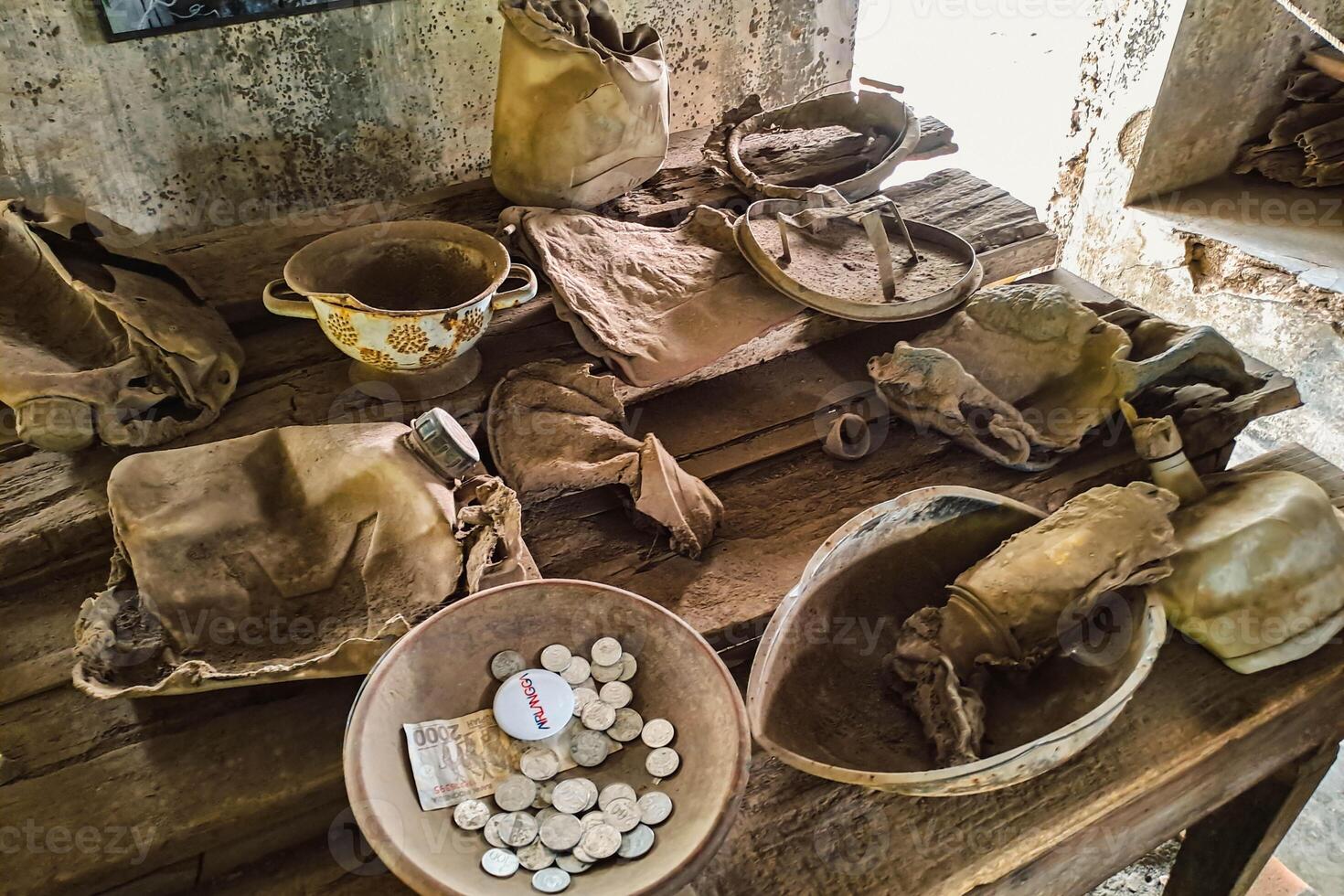 Household items identified from the remains of a particularly powerful volcanic eruption. Household items burned and destroyed due to the 2010 eruption of Mount Merapi photo