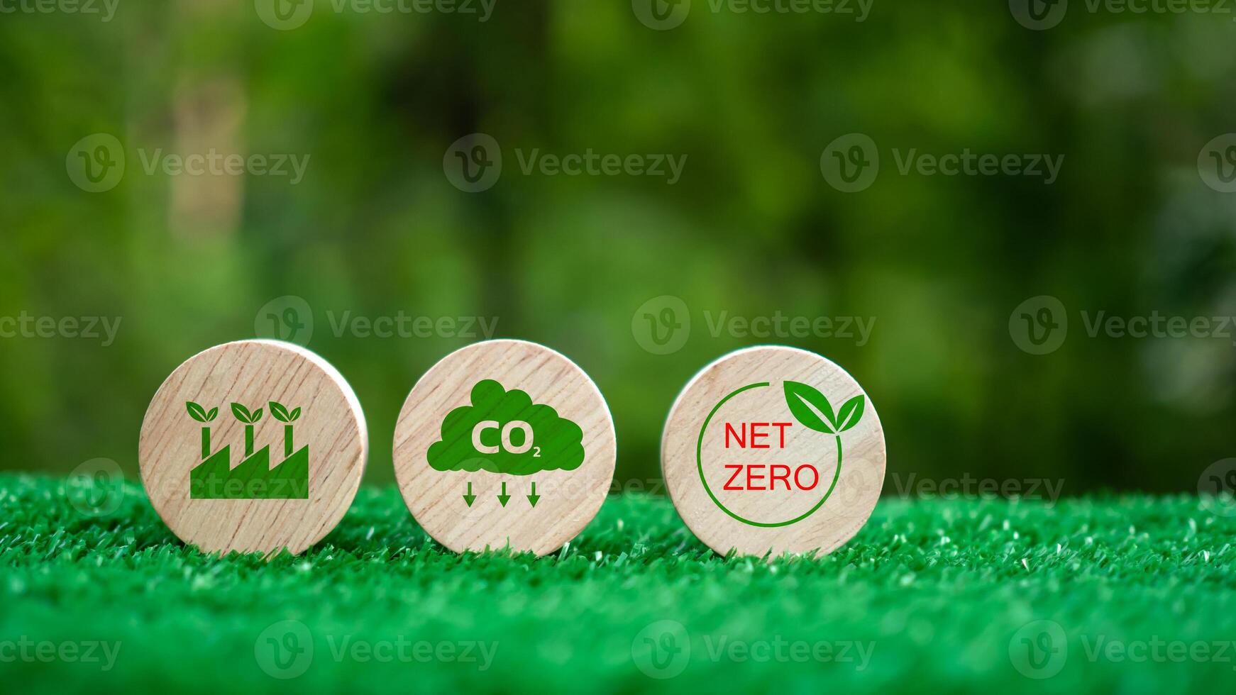 Three wooden circles with a green background and the words CO2, Net Zero. CO2 emission reduction concept, Clean environment without carbon dioxide emissions, Environmental protection concept. photo