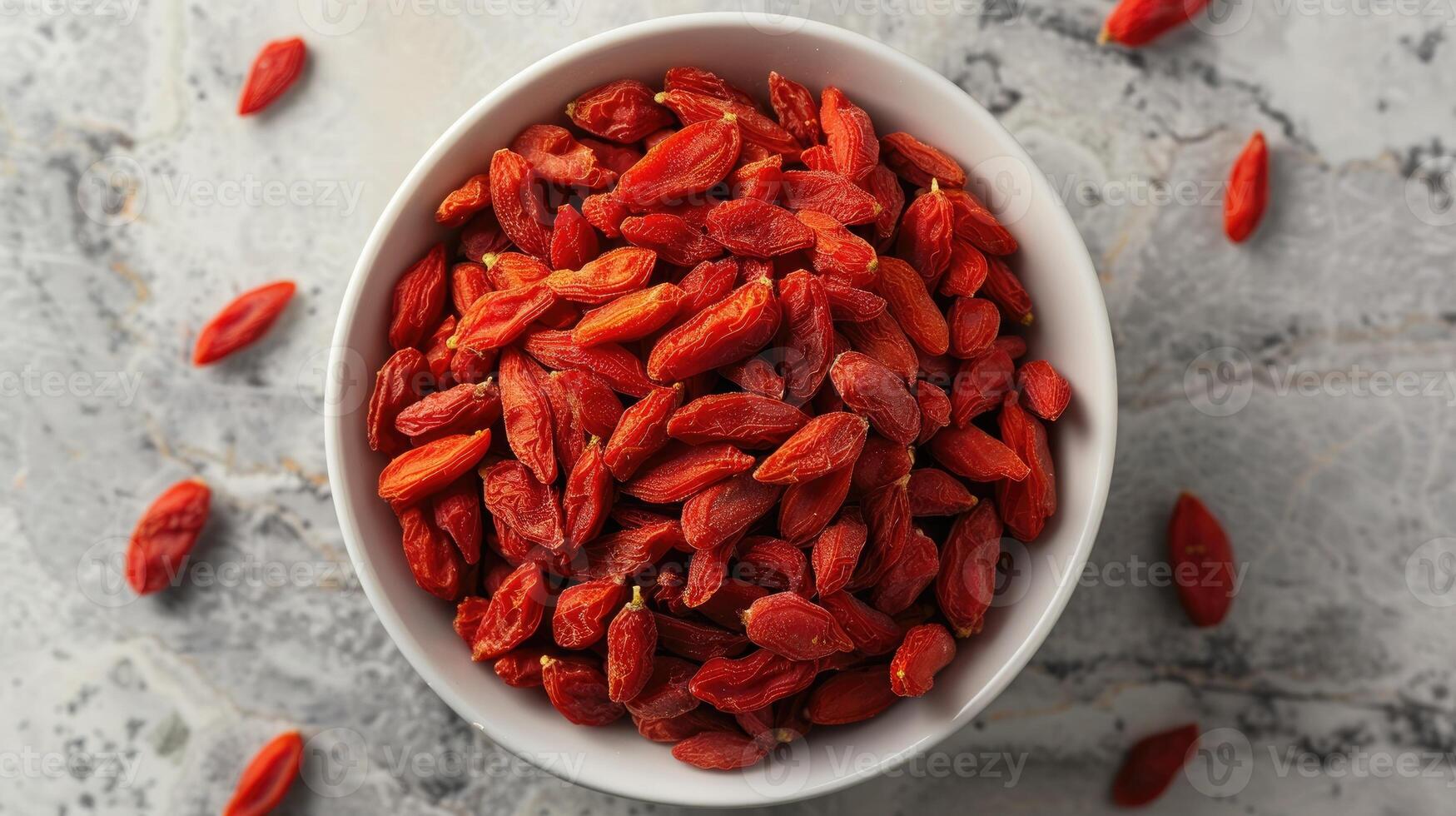 Bowl of dried goji berries emphasizing the vibrant red color and texture of the berries. photo