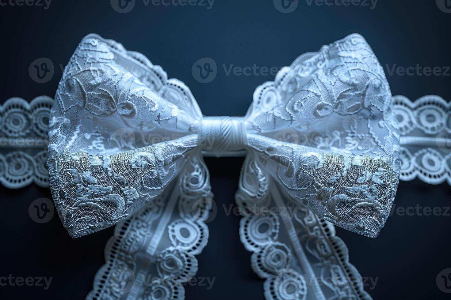 Elegant arrangement featuring delicate lace intertwined with a luxurious satin bow photo