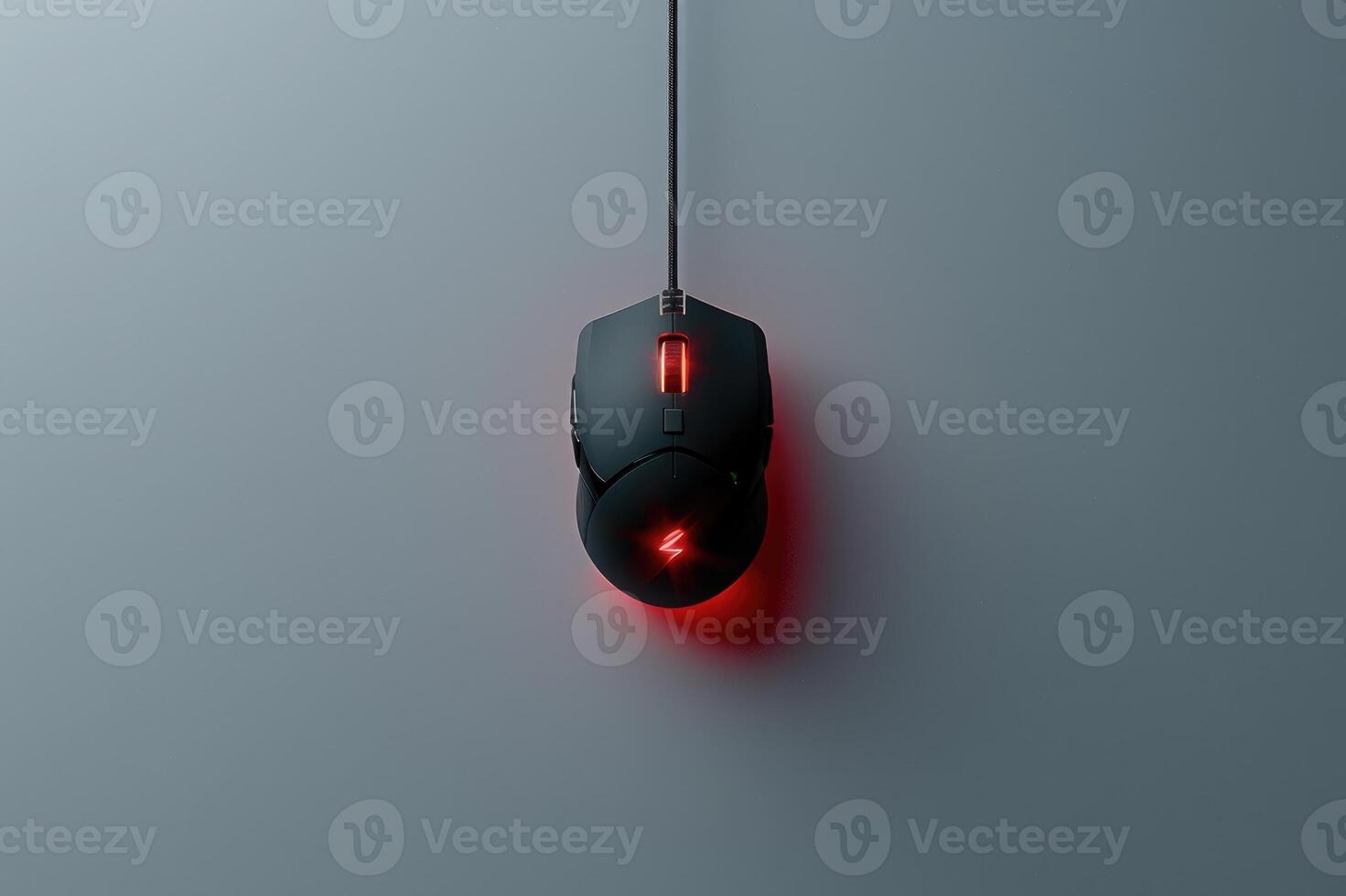 Image of a sleek, black mouse placed centrally on a minimalist grey surface. The design emphasizes simplicity and functionality, appealing to modern aesthetics. photo