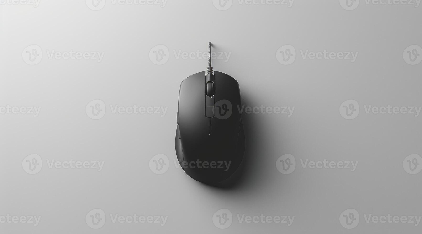 Image of a sleek, black mouse placed centrally on a minimalist grey surface. The design emphasizes simplicity and functionality, appealing to modern aesthetics. photo