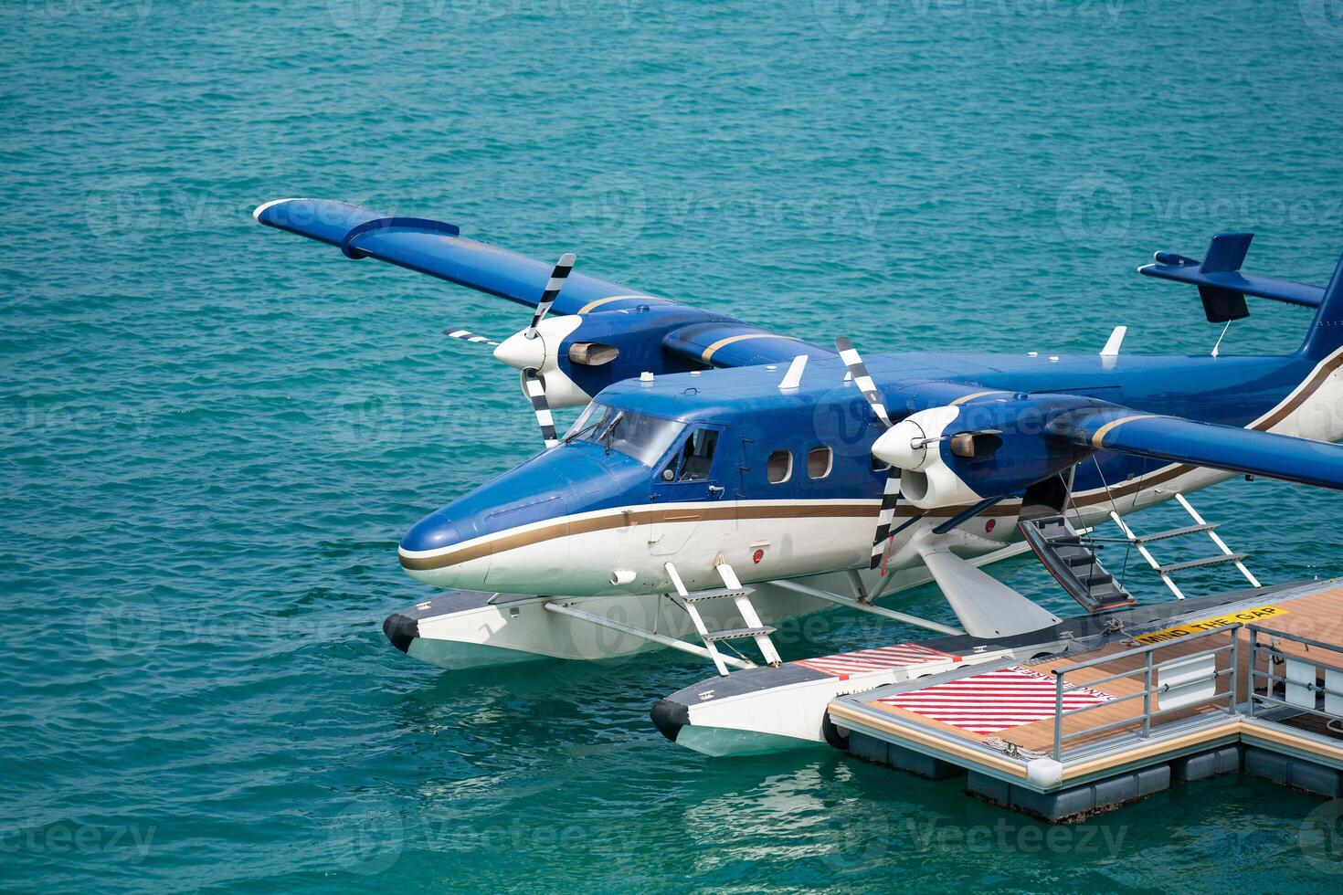 Seaplanes floating dock at Male airport, seaplanes in ocean lagoon. photo