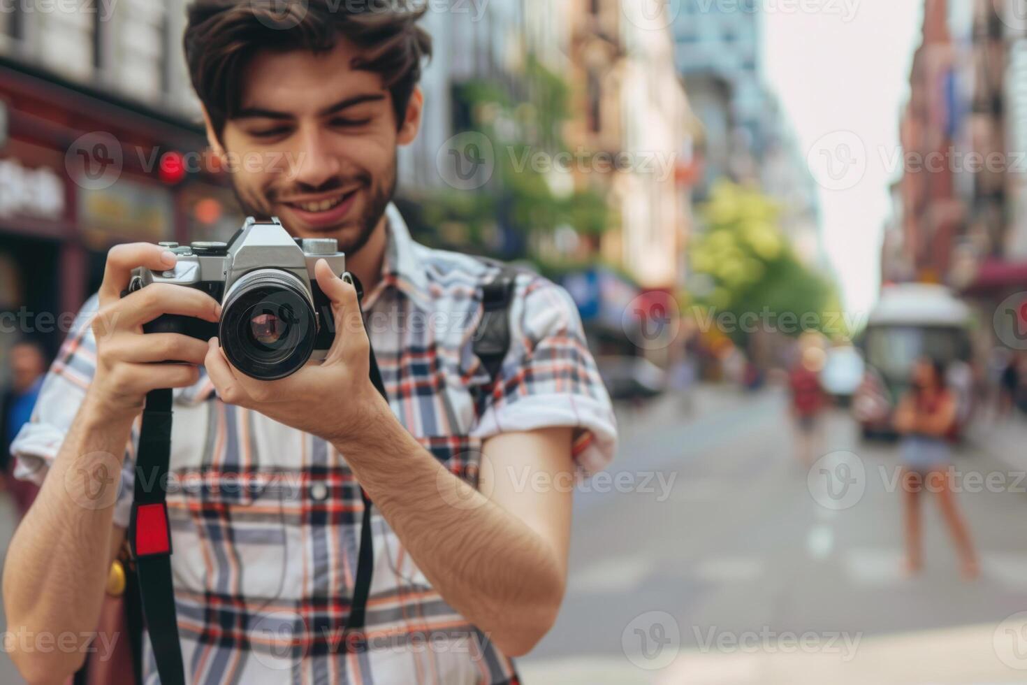 man using camera in street . photo