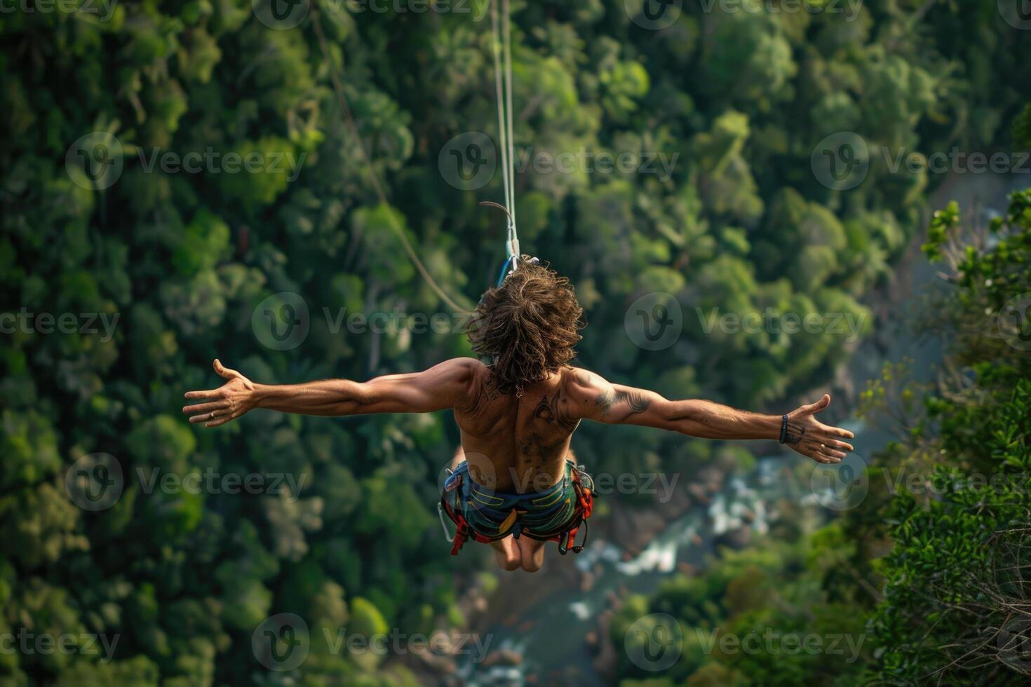 Rope jumping or bungee jumping, girl jumping to the bottom, extreme background. photo