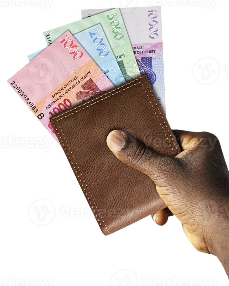 Black Hand Holding brown wallet With West African CFA franc notes. png