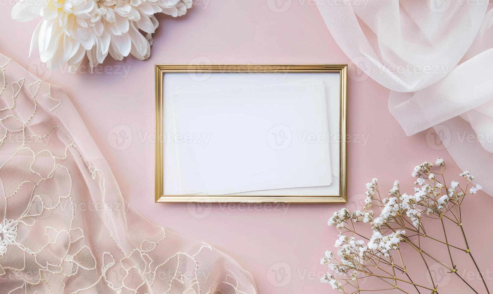 White blank card in an elegant gold frame on a pastel pink table, with a delicate lace cloth, soft lighting photo