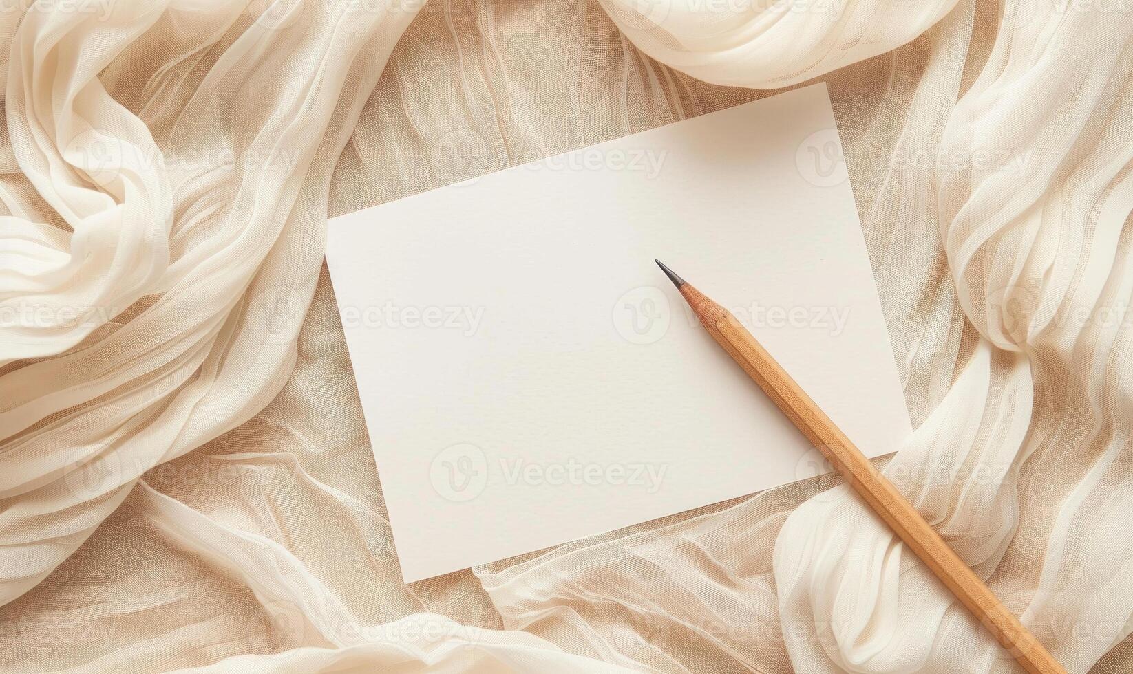 White blank card on a pastel cream background, with a piece of linen cloth and a handmade candle photo