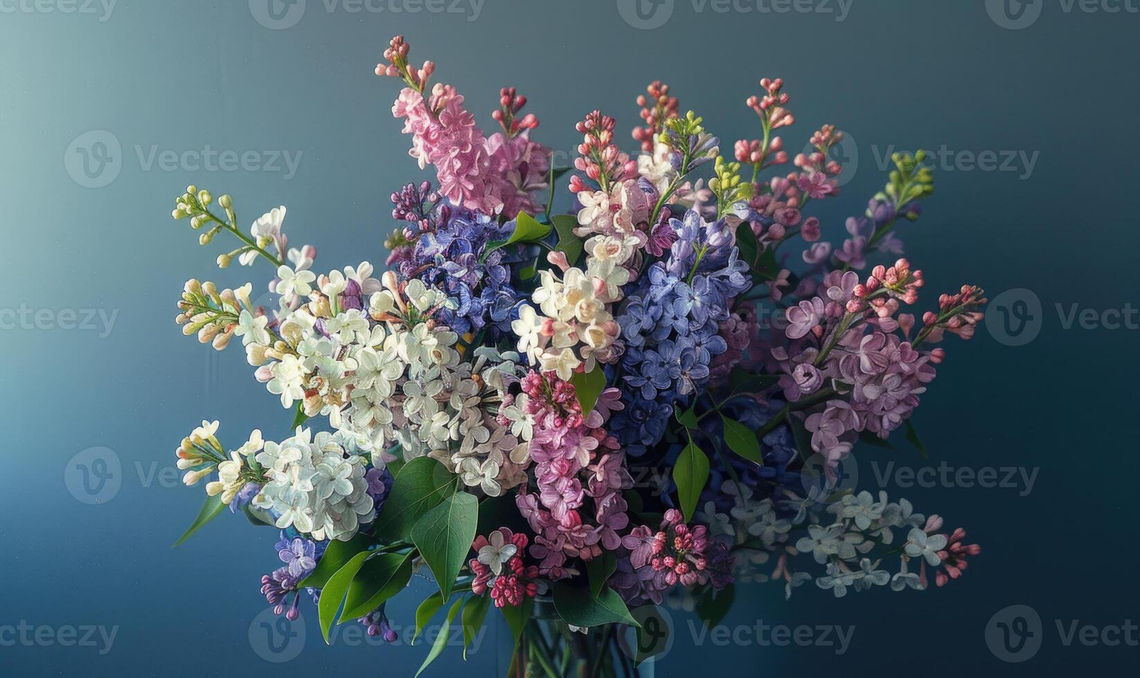 A bouquet featuring both lilacs and laburnums against blue wall photo