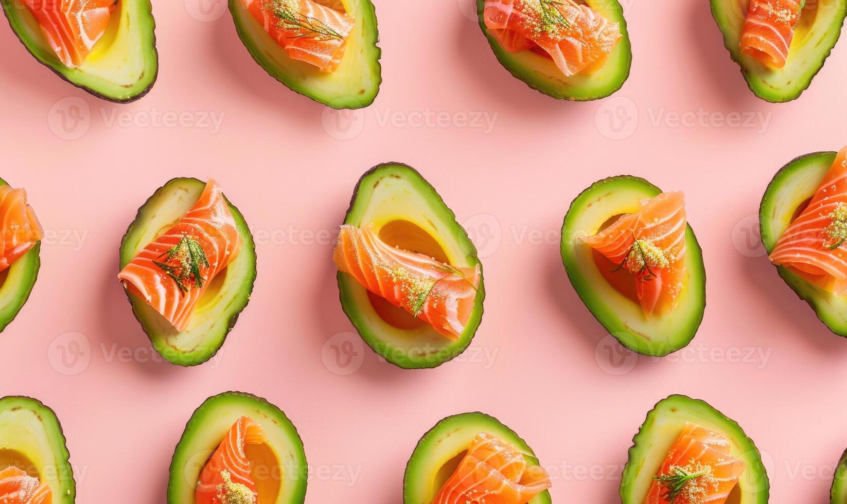 Avocado and smoked salmon bites on a light pink background photo