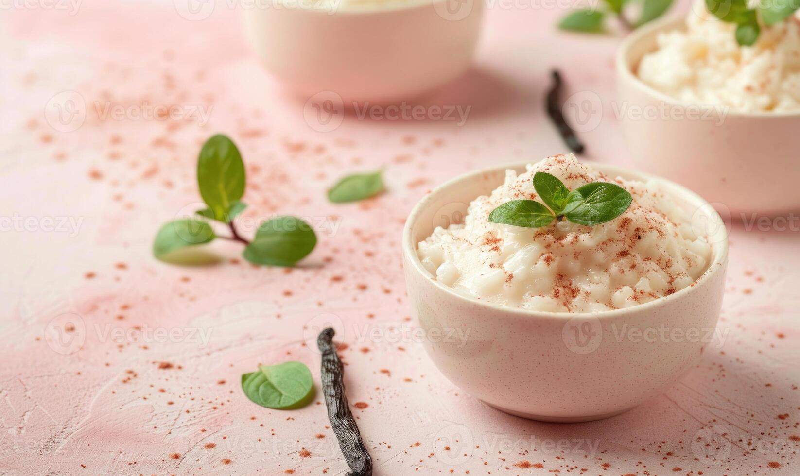Italian rice pudding with vanilla on a light pink background photo