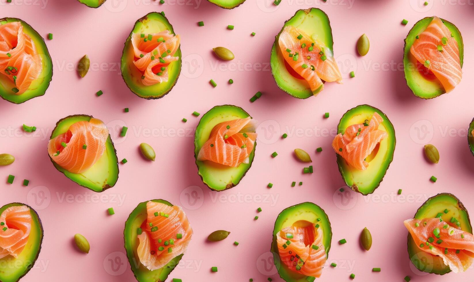 Avocado and smoked salmon bites on a light pink background photo