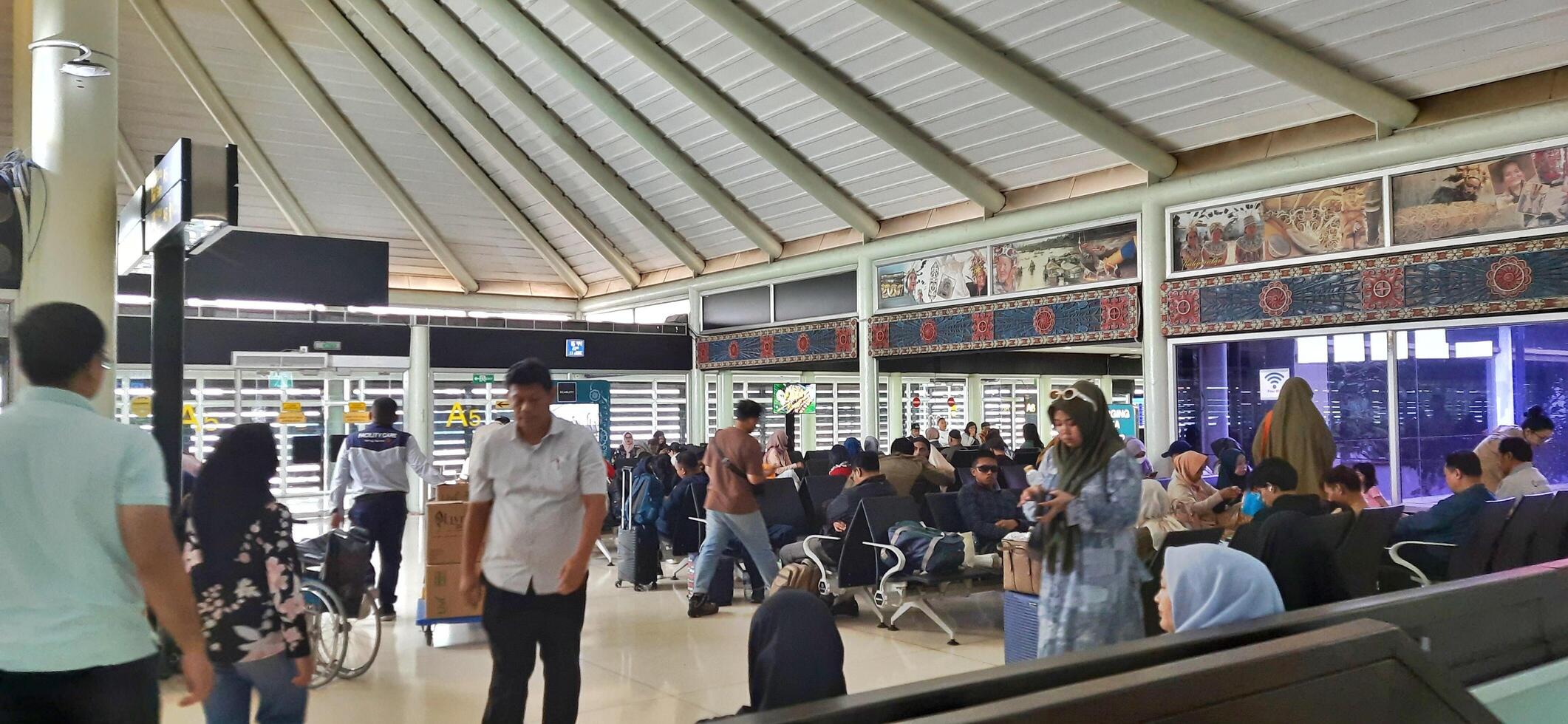View of passengers activity and interior at terminal 1A Soekarno-Hatta International airport Jakarta, Indonesia - June 11 2024 photo