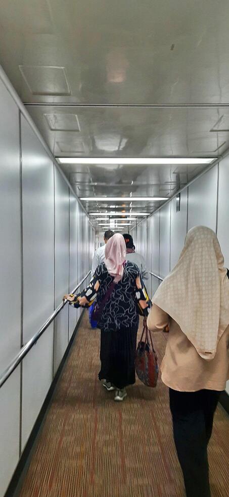 View of passengers activity and interior at terminal 1A Soekarno-Hatta International airport Jakarta, Indonesia - June 11 2024 photo