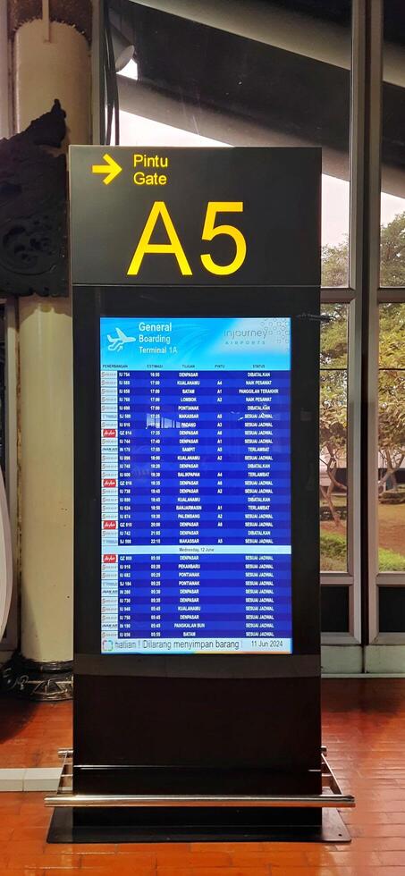 View of passengers activity and interior at terminal 1A Soekarno-Hatta International airport Jakarta, Indonesia - June 11 2024 photo