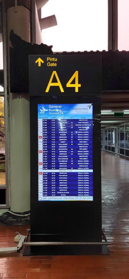 View of passengers activity and interior at terminal 1A Soekarno-Hatta International airport Jakarta, Indonesia - June 11 2024 photo