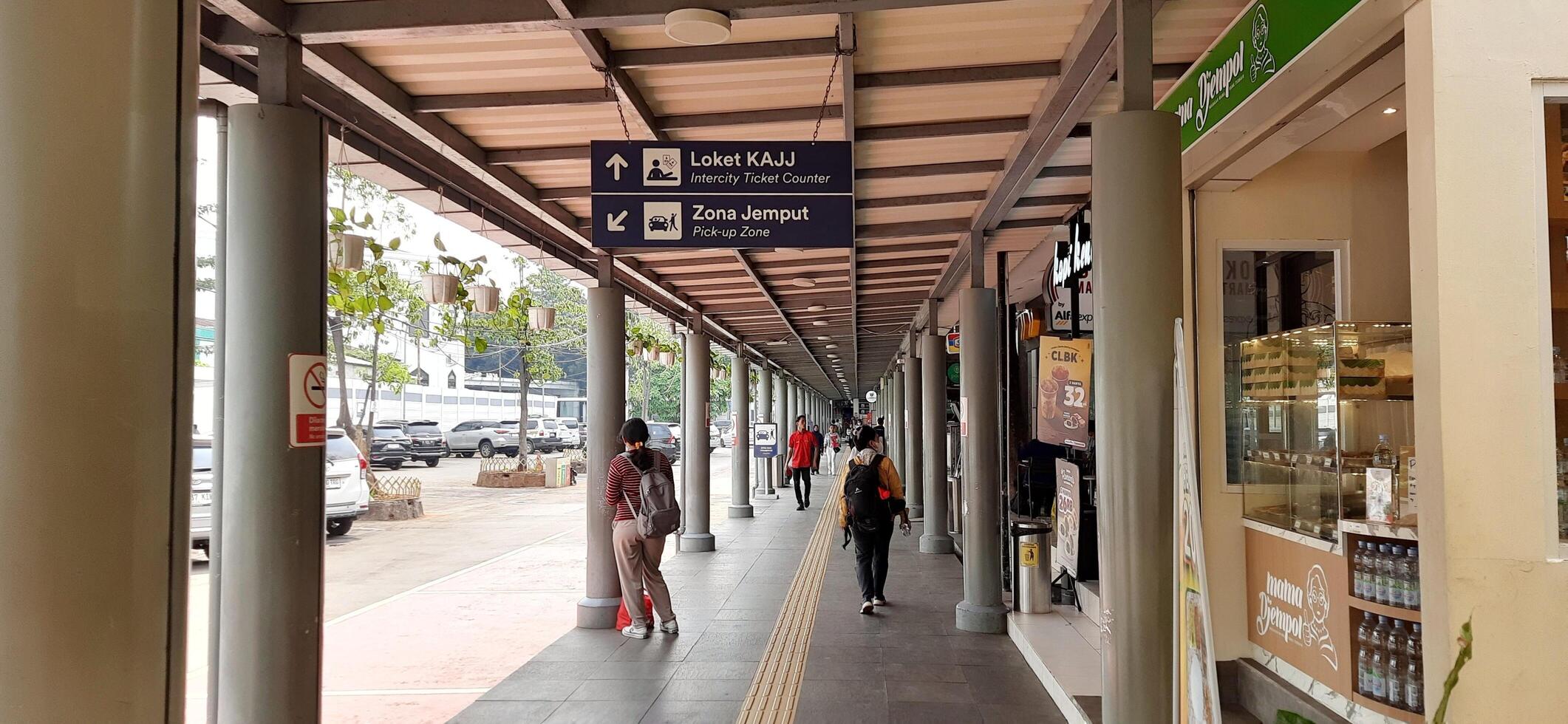 Atmosphere at railway train station. Local train activity in Indonesia. Railway road. Jakarta, Indonesia - Mei 28 2024 photo