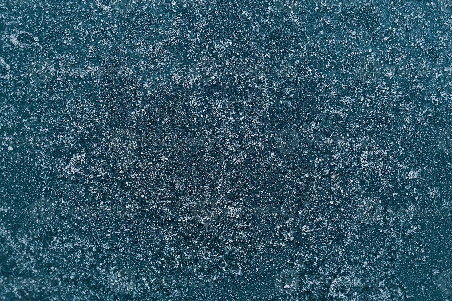 Frozen window. Abstract winter background - blue frozen window. photo