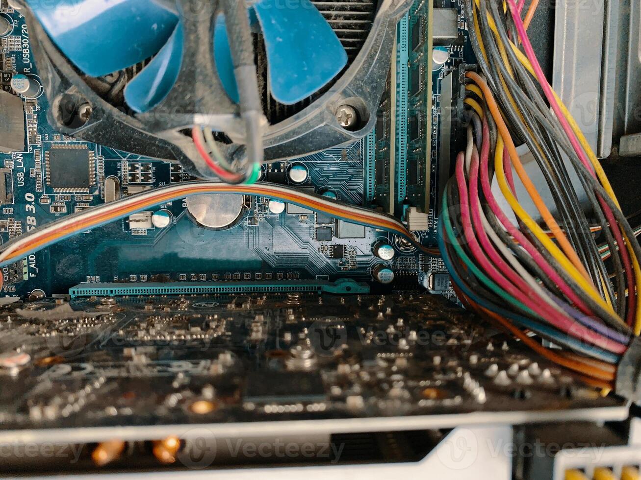 Dust in computer case. Big part of dirty dust on the computer pc processor cooler with mainboard. photo