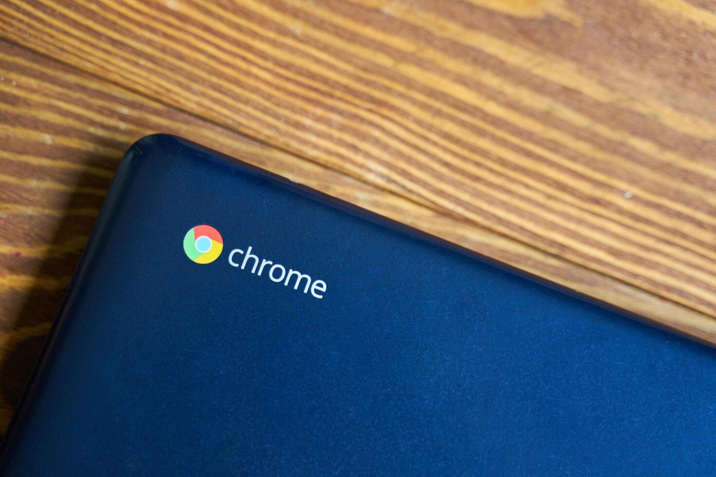 Bishkek, Kyrgyzstan - June 6, 2019. Asus Chromebook. Blue Chromebook on a table, side top view photo