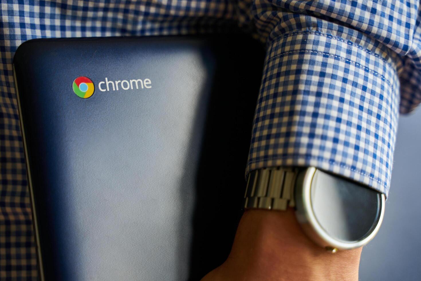Bishkek, Kyrgyzstan - June 6, 2019. Asus Chromebook in hand. photo